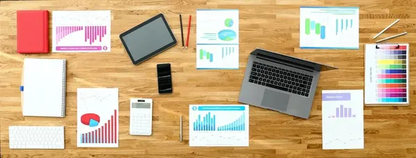 Paper with business chart on wooden office table