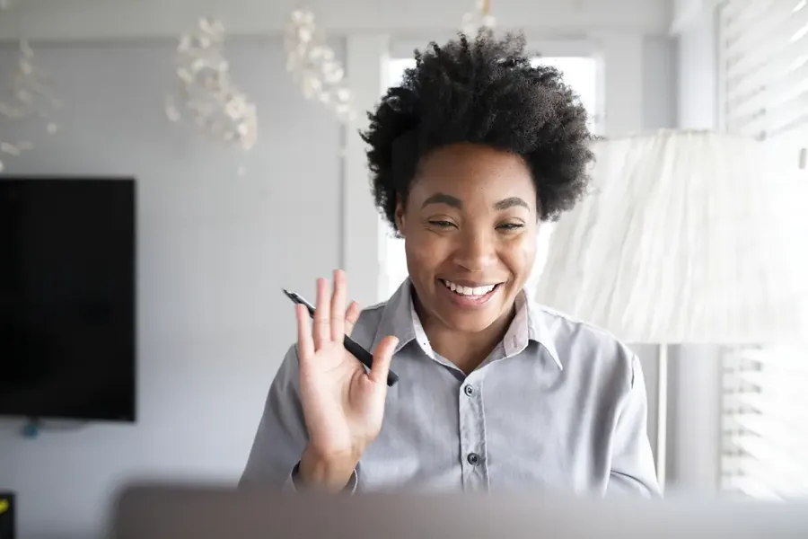 Woman having an online class studying through e-learning system