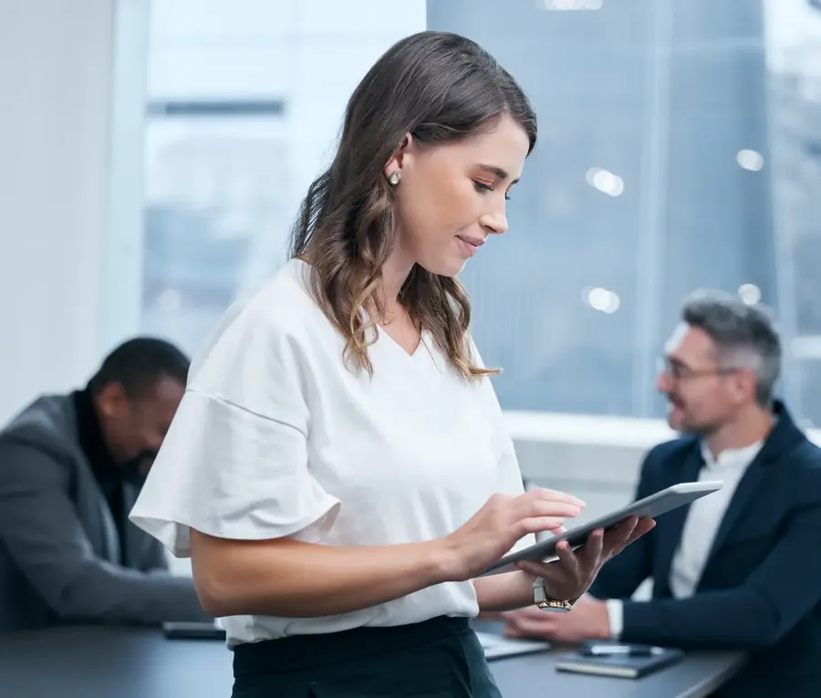 Check employee and woman in boardroom tablet and confidence in corporate and auditor Office bookkeeper and person on table business meeting and collaboration for planning of project and goals